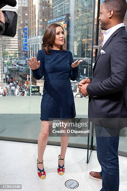 Calloway interviews Megan Boone during her visit to "Extra" at their New York studios at H&M in Times Square on May 12, 2015 in New York City.