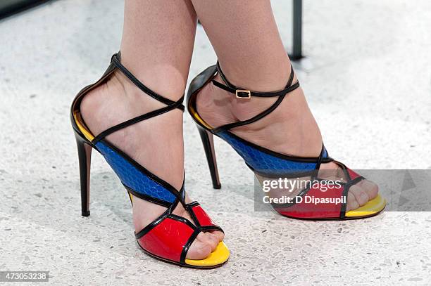 Megan Boone, shoe detail, visits "Extra" at their New York studios at H&M in Times Square on May 12, 2015 in New York City.
