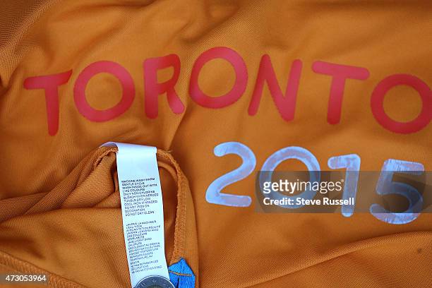 Pan Am T-shirts and water bottles provided to Pan Am volunteers not up to snuff. Bottle leaks and logos wash off shirts. In Toronto.