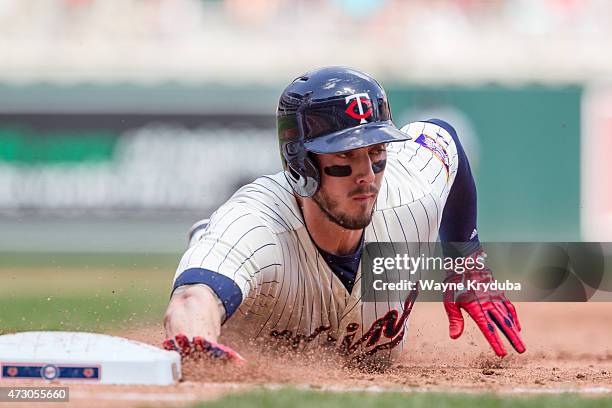 Jordan Schafer of the Minnesota Twins slides back to first base in a game against the Chicago White Sox on May 2, 2015 at Target Field in...