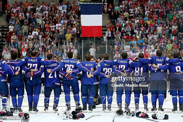 The team of France celebrate victory over Latvia after the IIHF World Championship group A match between Latvia and France at o2 Arena on May 12,...