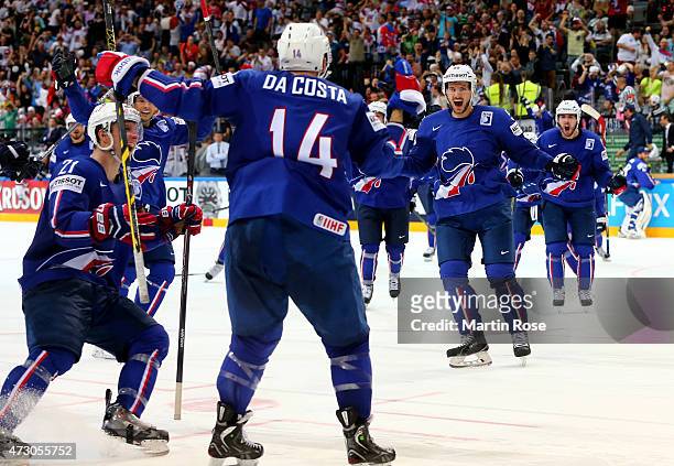 The team of France celebrate victory over Latvia after the IIHF World Championship group A match between Latvia and France at o2 Arena on May 12,...