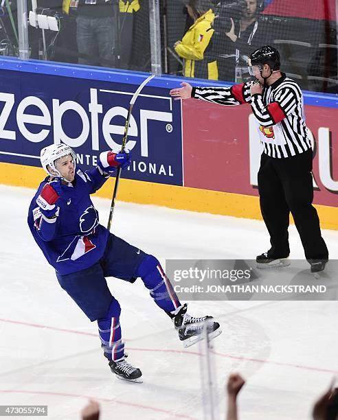 Forward Stephane da Costa of France celebrates after scoring the last penalty shootout past goalkeeper Edgars Masalskis of Latvia to win the group A...