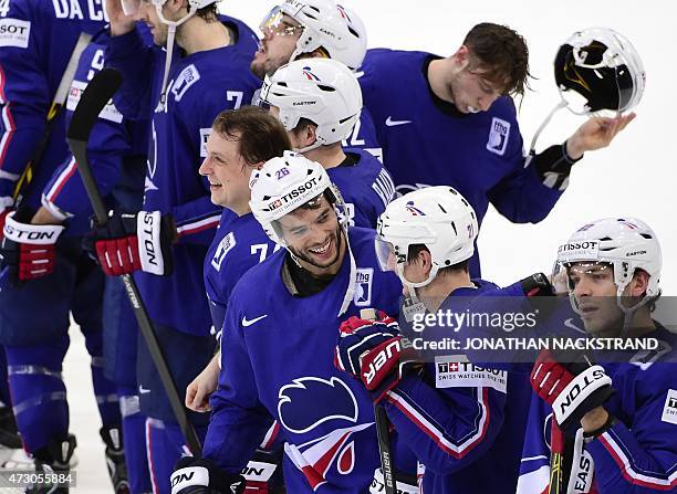 Players of team France celebrate after winning over Latvia at the end of a penalty shootout during the group A preliminary round match Latvia vs...