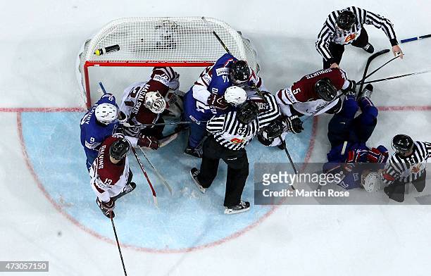 Players of Latvia and of France fight during the IIHF World Championship group A match between Latvia and France at o2 Arena on May 12, 2015 in...