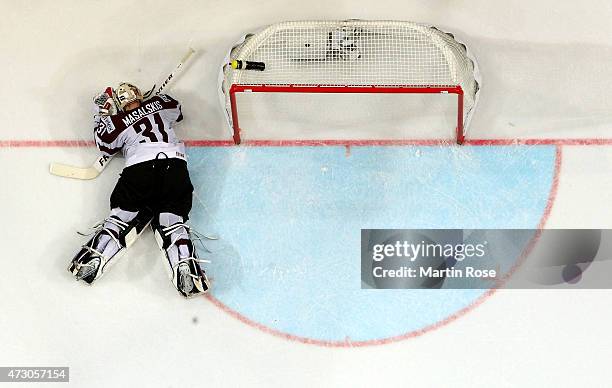 Edgars Masalskis, goaltender of Latvia lies on the ice during the IIHF World Championship group A match between Latvia and France at o2 Arena on May...