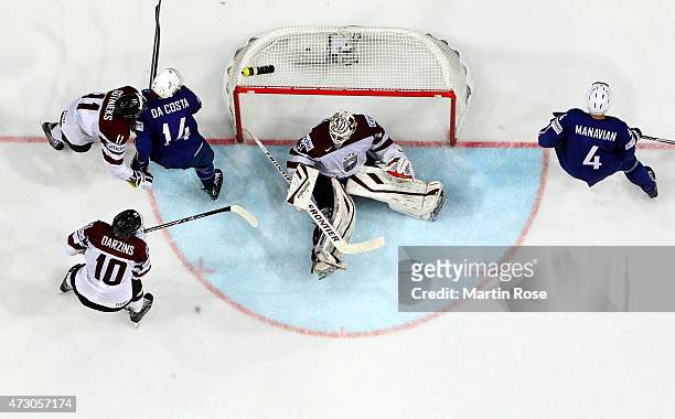 Edgars Masalskis, goaltender of Latvia tends net against France during the IIHF World Championship group A match between Latvia and France at o2...