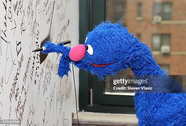 Sesame Street's Grover signs the wall at AOL Build Speaker Series: "Sesame Street's Grover And The USO - Dr. Jeanette Betancourt And Rachel Tischler"...