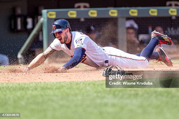 Jordan Schafer of the Minnesota Twins slides for home plate in a game against the Chicago White Sox on May 3, 2015 at Target Field in Minneapolis,...