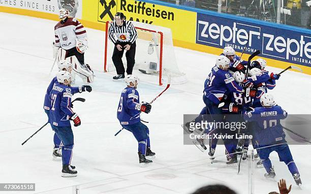 French player's celebrate the victory after the penalty shoot of Teddy Da Costa during the 2015 IIHF World Championship between Latvia and France at...