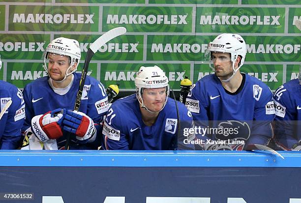 Stephane Da Costa, Antoine Roussel and Damien Fleury of France react during the 2015 IIHF World Championship between Latvia and France at O2 arena...