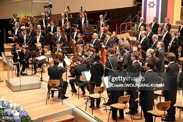 Musicians of the Berlin Philharmonic play during a celebration of 50 years of the beginning of diplomatic relations between Germany and Israel at the...