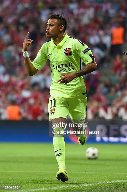 Neymar of Barcelona celebrates as he scores their first goal during the UEFA Champions League semi final second leg match between FC Bayern Muenchen...