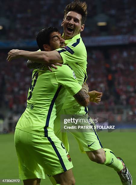 Barcelona's Argentinian forward Lionel Messi reacts after a goal ny Barcelona's Brazilian forward Neymar da Silva Santos Junior during the UEFA...