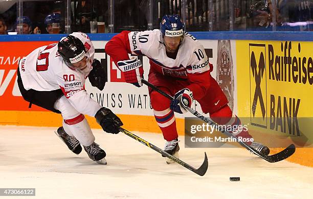 Roman Cervenka of Czech Republic and Roman Josi of Switzerland battle for the puck during the IIHF World Championship group A match between Czech...