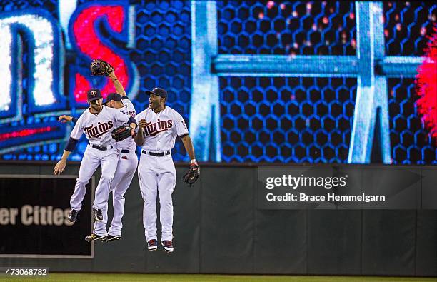 Torii Hunter of the Minnesota Twins celebrates with Shane Robinson and Jordan Schafer against the Detroit Tigers on April 28, 2015 at Target Field in...