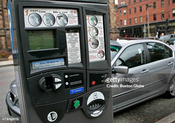 New style parking meters on Newbury Street, which accept coins, dollar bills, certain credit cards and debit cards.