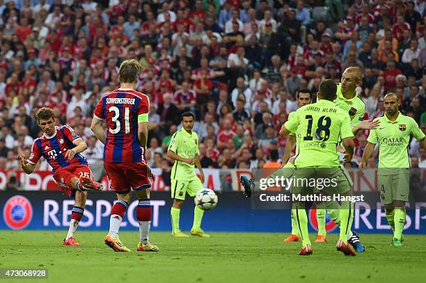 Thomas Mueller of Bayern Muenchen scores their third goal during the UEFA Champions League semi final second leg match between FC Bayern Muenchen and...