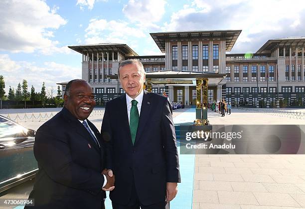 Turkish President Recep Tayyip Erdogan shakes hands with Gabonese President Ali Bongo Ondimba at the Presidential Palace in Ankara, Turkey on May 12,...