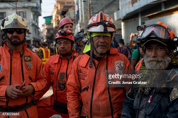 South American rescue team try to rescue a young boy that was believed to be trapped under the rubble of a house that collapsed following a second...