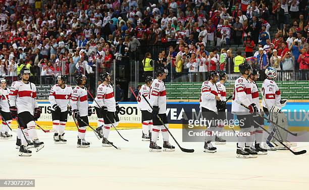 Team members of Switzerland look dejected after losing the IIHF World Championship group A match between Czech Republic and Switzerland at o2 Arenaon...