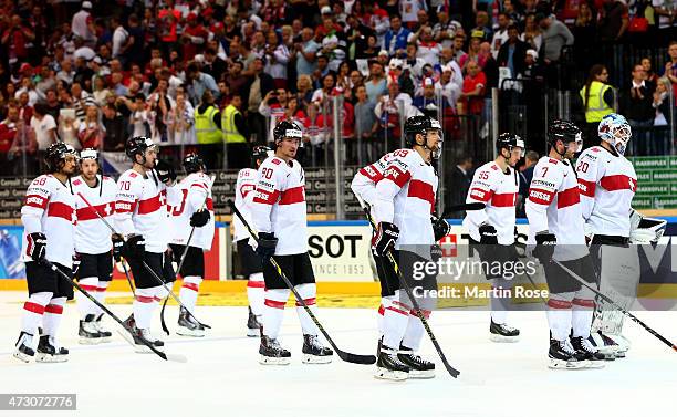 Team members of Switzerland look dejected after losing the IIHF World Championship group A match between Czech Republic and Switzerland at o2 Arenaon...