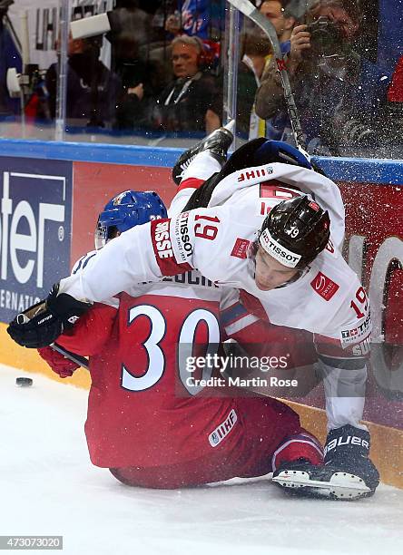 Jakub Krejcik of Czech Republic and Reto Schappi of Switzerland battle for the puck during the IIHF World Championship group A match between Czech...