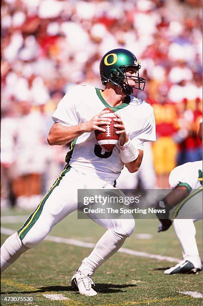 Joey Harrington of the Oregon Ducks drops back to pass against the USC Trojans on October 14, 2000.