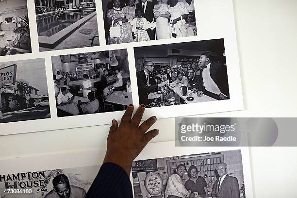 Enid Curtis Pinkney, Founding President and CEO of the Historic Hampton House Community Trust, points to a photograph of Malcolm X and Mohammad Ali...