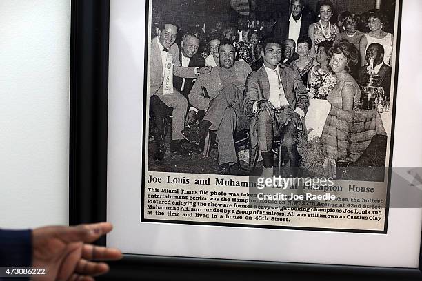 Enid Curtis Pinkney, Founding President and CEO of the Historic Hampton House Community Trust, points to a photograph of boxers, Joe Louis and...