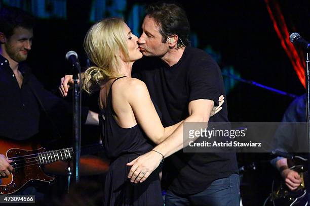 Actors Gillian Anderson and David Duchovny attend David Duchovny in concert at The Cutting Room on May 12, 2015 in New York City.