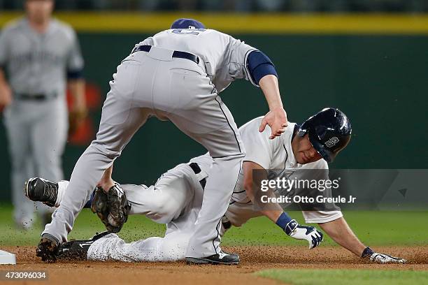 Seth Smith of the Seattle Mariners is tagged out at second base by shortstop Clint Barmes of the San Diego Padres who tried to stretch a single into...