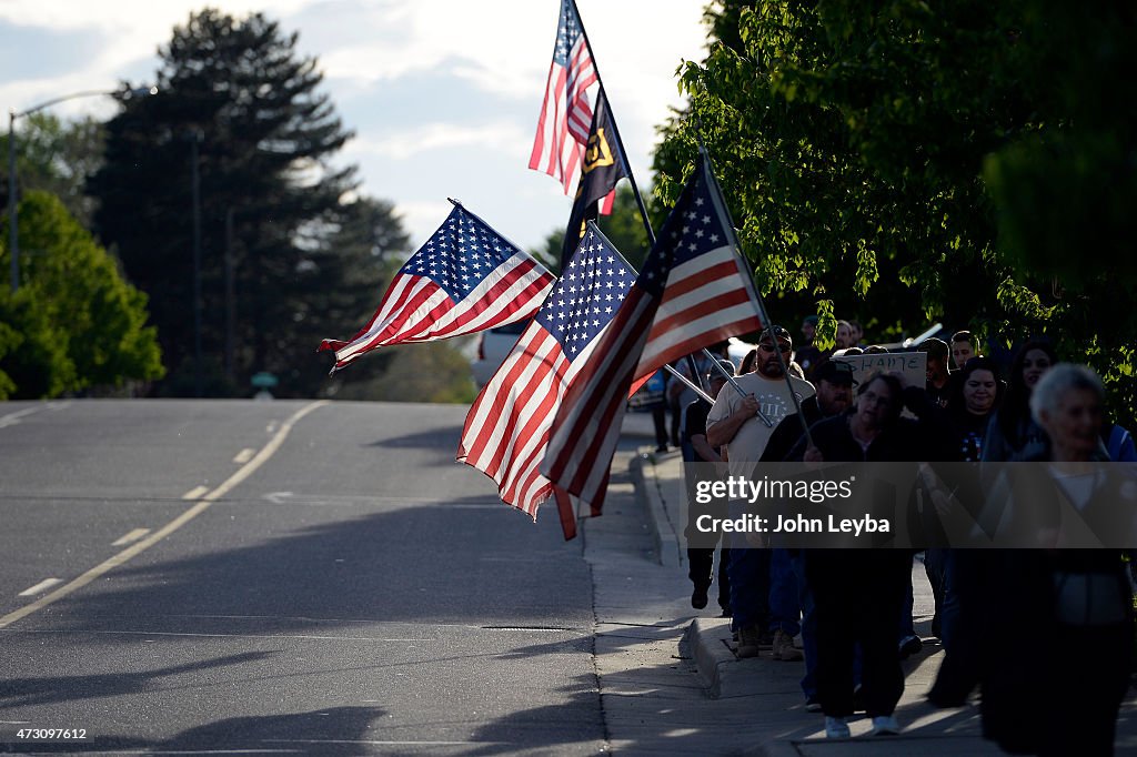 Protesters march to Glendale City Hall May...