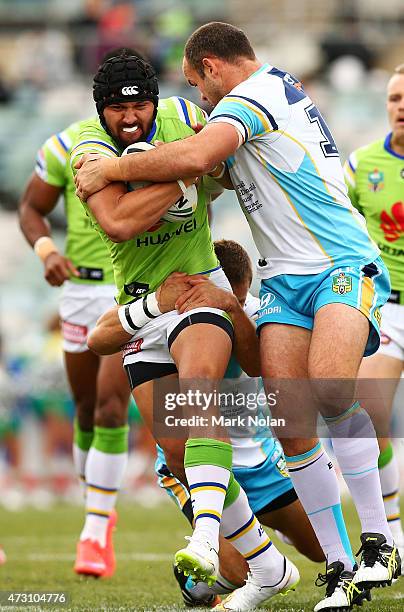 Jordan Rapana of the Raiders is tackled during the round nine NRL match between the Canberra Raiders and the GOld Coast Titans at GIO Stadium on May...