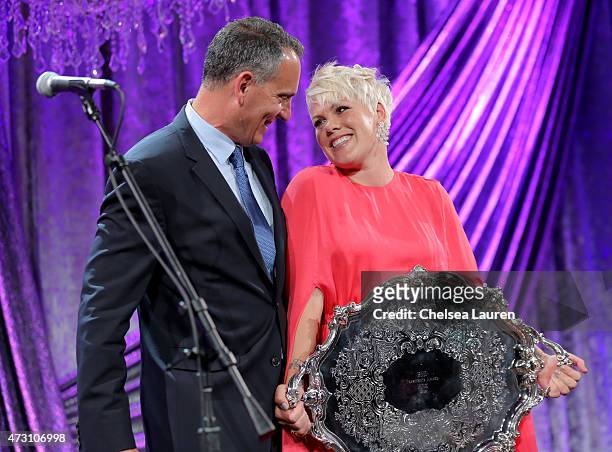 President & CEO Mike O'Neill and honoree P!nk pose with the BMI President's Award during the 63rd Annual BMI Pop Awards held at the Beverly Wilshire...