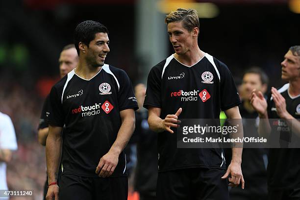 Luis Suarez and Fernando Torres chat to each other after the Liverpool All-Star Charity match at Anfield on March 29, 2015 in Liverpool, England.