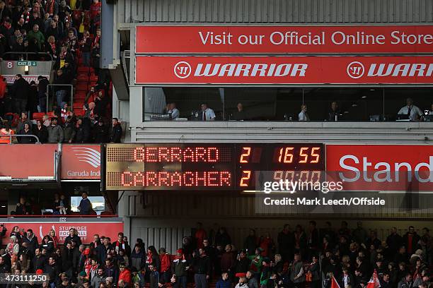 The scoreboard shows the final score, with Steven Gerrard and Jamie Carragher's teams drawing 2-2 in the Liverpool All-Star Charity match at Anfield...