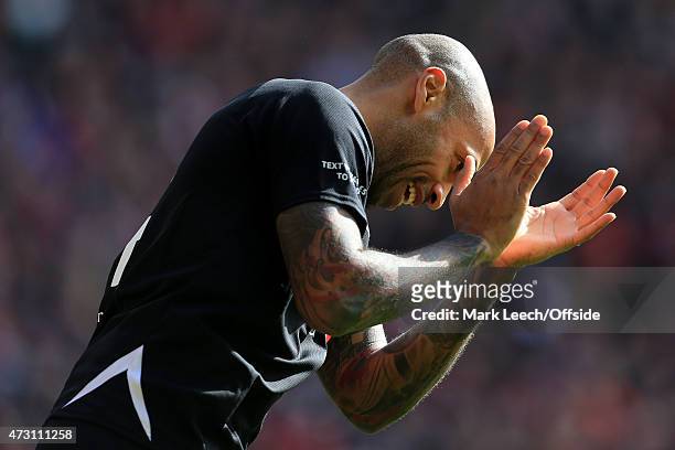 Thierry Henry applauds during the Liverpool All-Star Charity match at Anfield on March 29, 2015 in Liverpool, England.