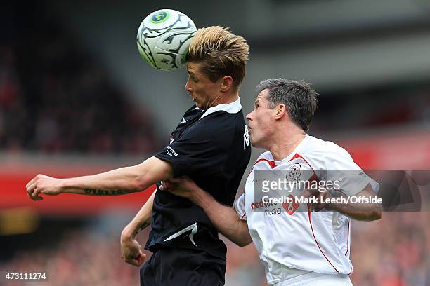 Fernando Torres battles with Jamie Carragher during the Liverpool All-Star Charity match at Anfield on March 29, 2015 in Liverpool, England.