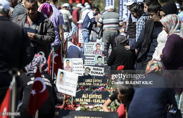 Relatives and friends gather at the cemetery in the Turkish town of Soma in the Manisa district, western Turkey, on May 13, 2015 to mark the first...