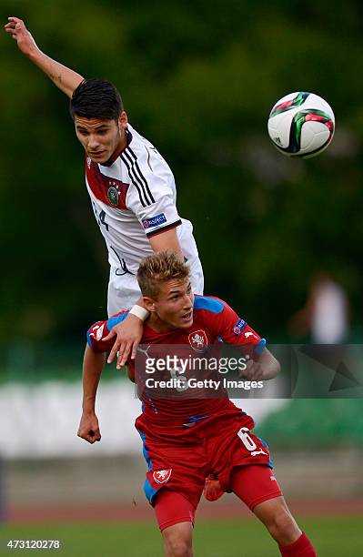 Görkem Saglam of Germany U17 jumps for the ball with Michal Sadílek of Czech Republic U17 during the UEFA European Under-17 Championship match...