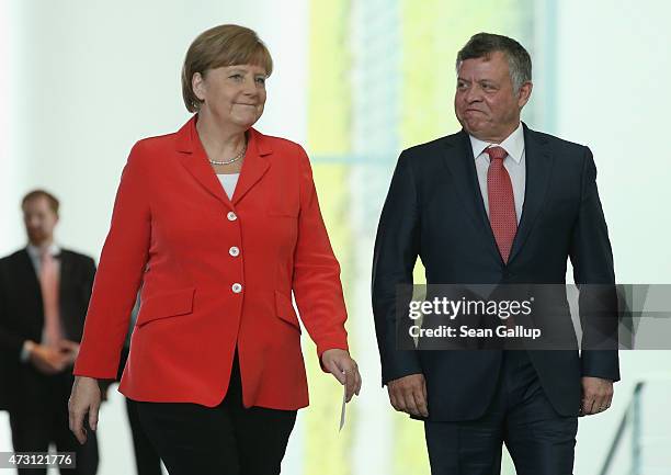 German Chancellor Angela Merkel and King Abdullah II of Jordan arrive to speak to the media following talks at the Chancellery on May 13, 2015 in...