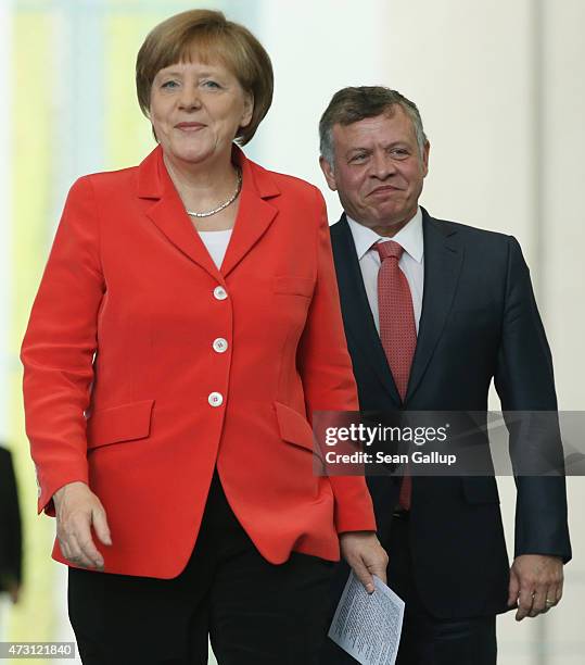 German Chancellor Angela Merkel and King Abdullah II of Jordan arrive to speak to the media following talks at the Chancellery on May 13, 2015 in...