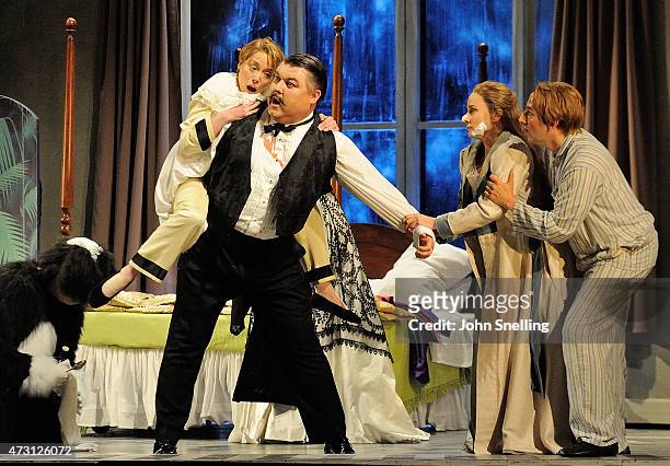 Peter Pan the Opera at the Welsh National Opera with Rebecca Bottone as Michael Ashley Holland as Mr Darling Marie Arnet as Wendy and Nicholas...