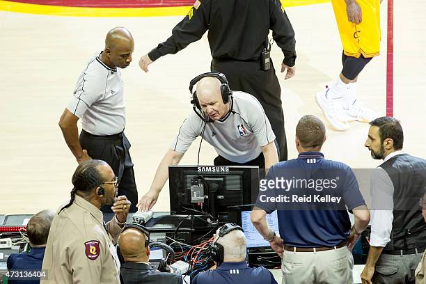 Referee Joe Crawford reviews a play from the replay center in Secaucus, NJ during the game between the Cleveland Cavaliers and Chicago Bulls in Game...