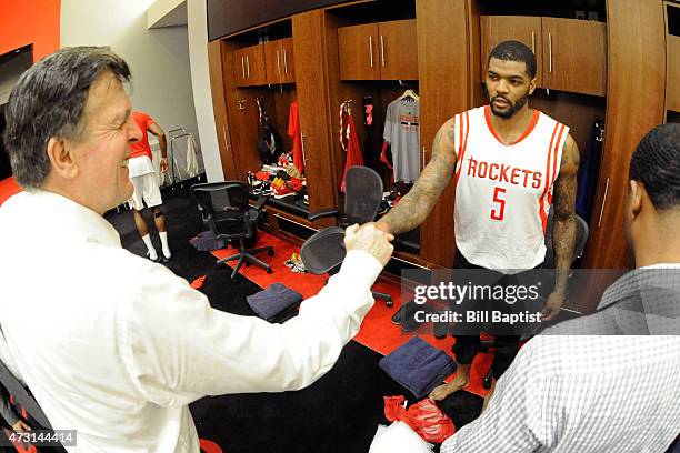 Head coach, Kevin McHale of the Houston Rockets fist bumps with Josh Smith after the win against the Los Angeles Clippers for Game Five of the...