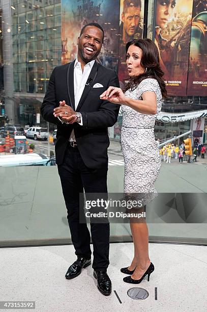 Calloway interviews Jenni Pulos during her visit to "Extra" at their New York studios at H&M in Times Square on May 13, 2015 in New York City.