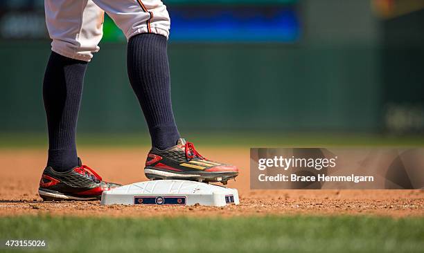 The Adidas shoes of Jordan Schafer of the Minnesota Twins stand on third base against the Chicago White Sox on May 3, 2015 at Target Field in...