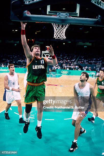 Arvydas Sabonis of the Lithuanian Mens Olympic Basketball Team shoots the ball circa 1996 during the 1996 Summer Olmpyics at the Georgia Dome in...