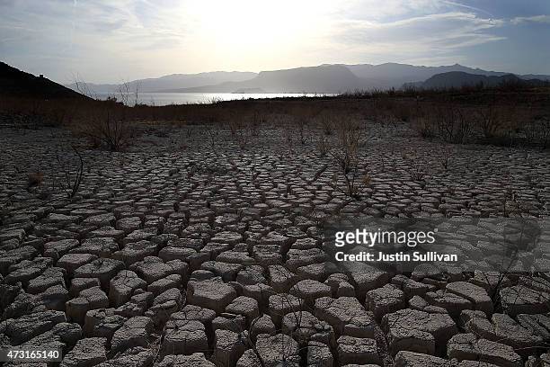 Dry cracked earth that used to be the bottom of Lake Mead is seen near Boulder Beach on May 13, 2015 in Lake Mead National Recreation Area, Nevada....